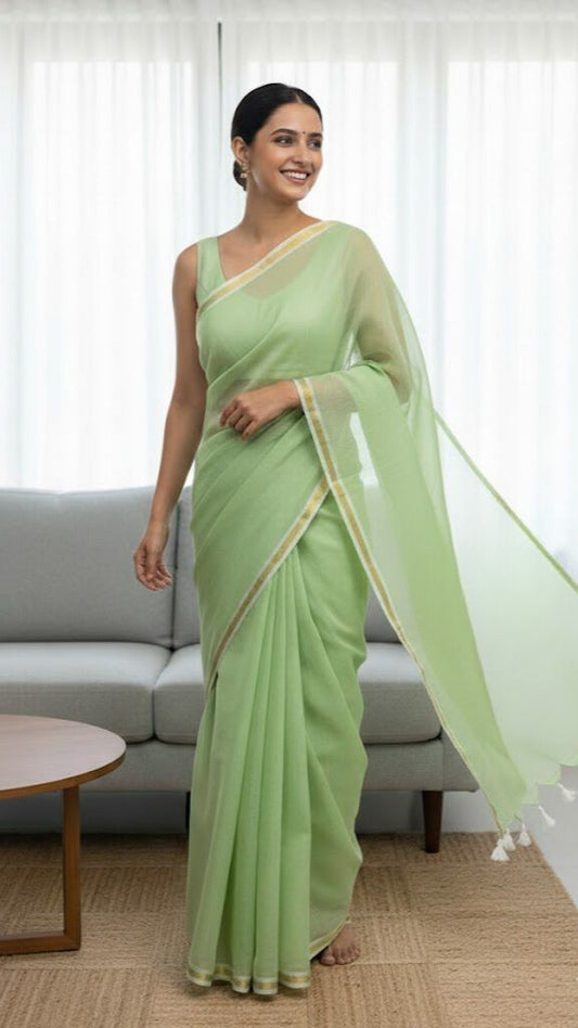 Light Pastel Green -Mul cotton saree with thin jori border.