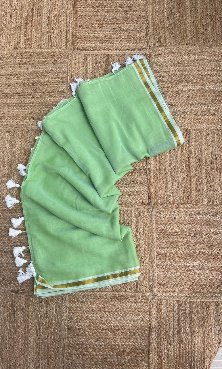 Light Pastel Green -Mul cotton saree with thin jori border.